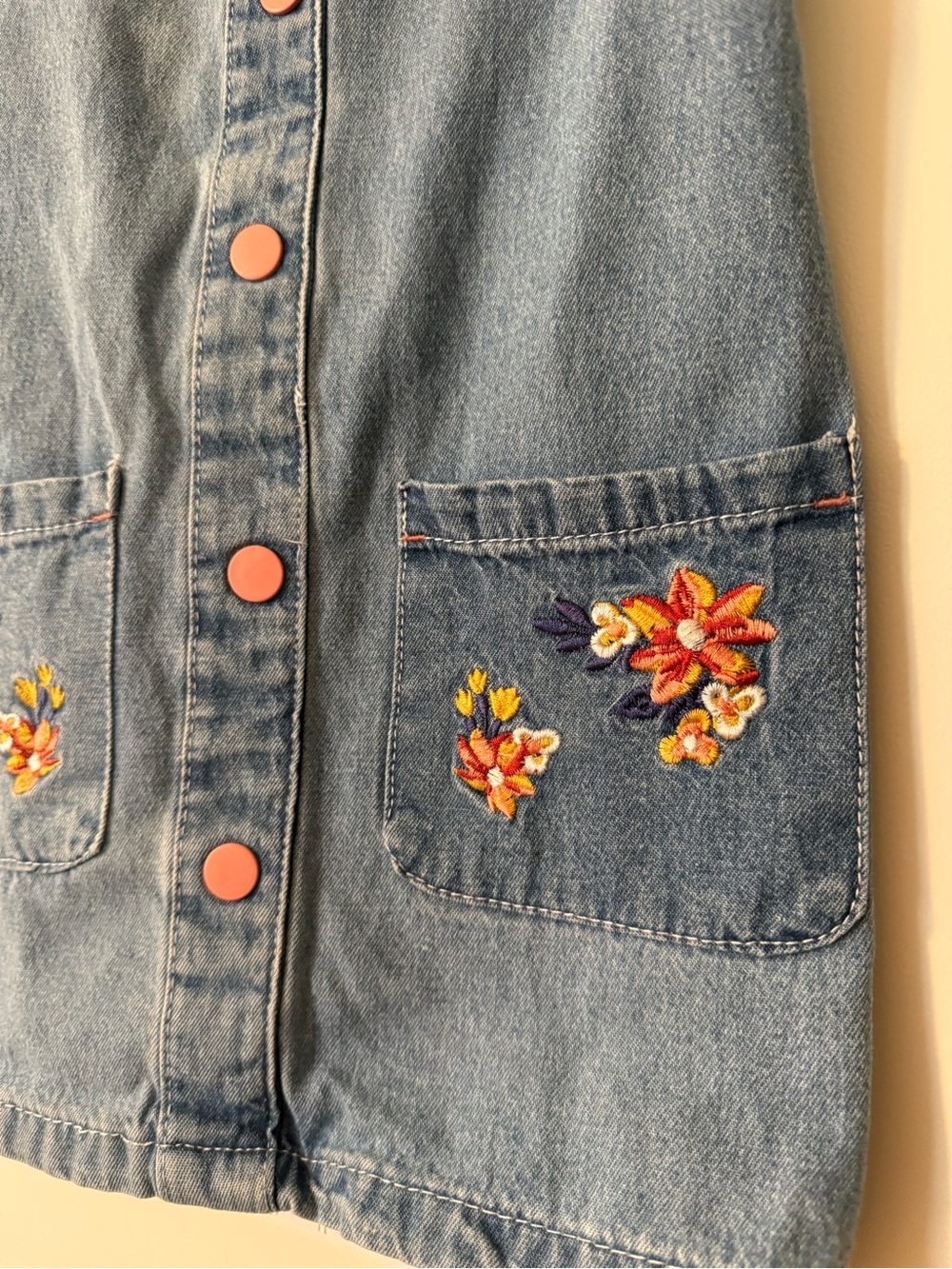 Girls Denim Pinafore Dress with Pink Buttons and Floral Embroidered Pockets - Picture 2 of 7